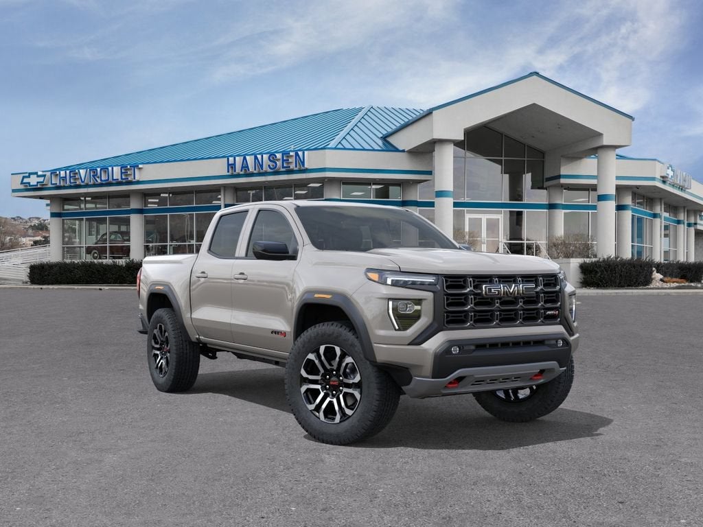 2026 GMC Canyon AT4 in Coastal Dune — front three-quarter view